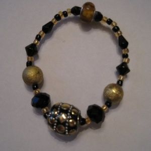 Gold / Black colored stretch hand beaded bracelet